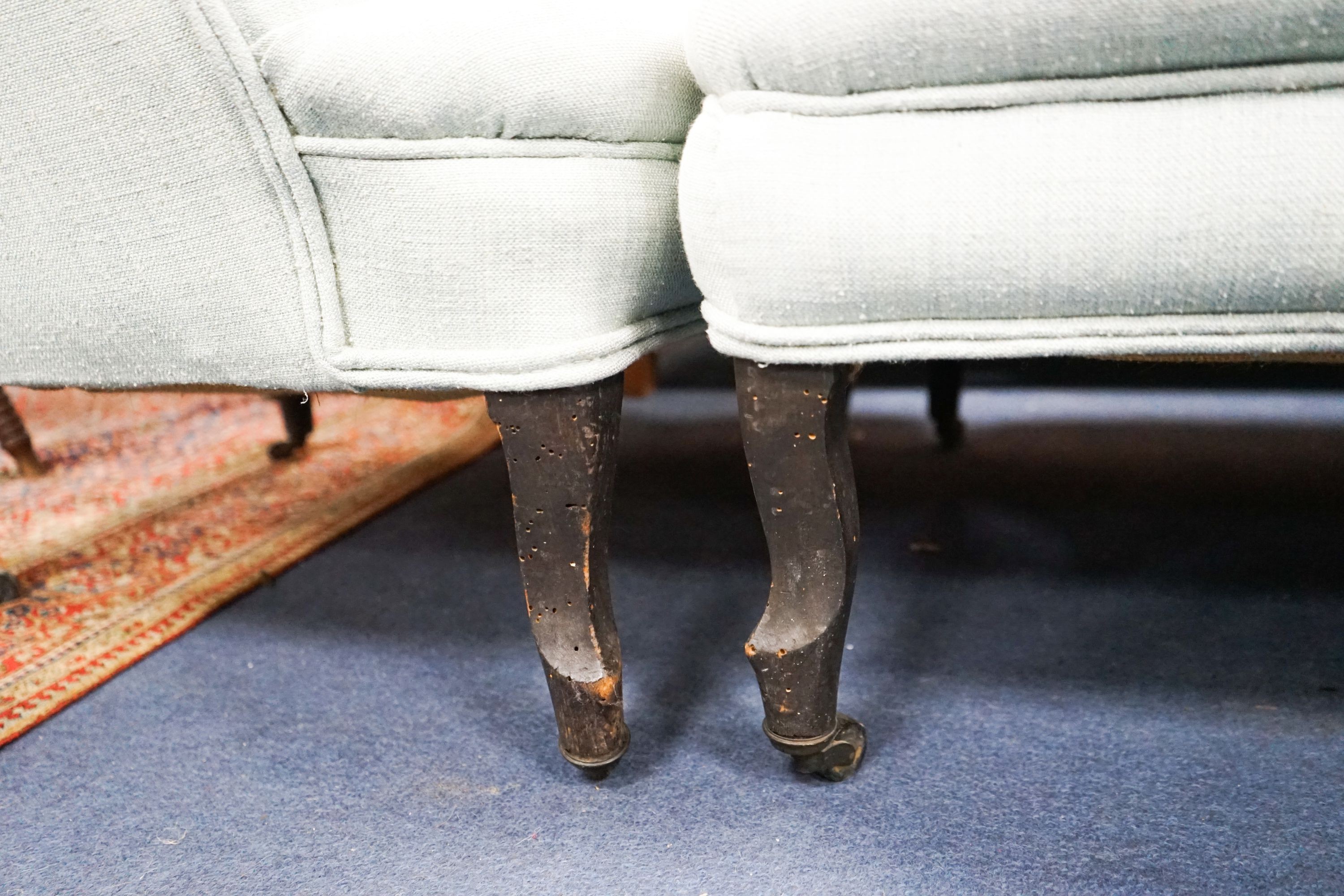 A French Duchesse Brisee comprising a pair of tub armchair and matching stool, on carved beech cabriole legs, chairs width 82cm